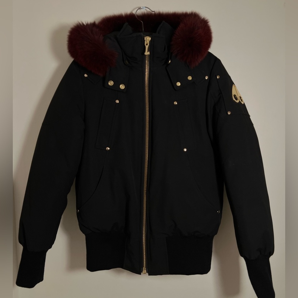 Moose Knuckles 
Black with detachable natural dyed blue fox fur never worn